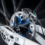 A- lose up of a bikes front wheel