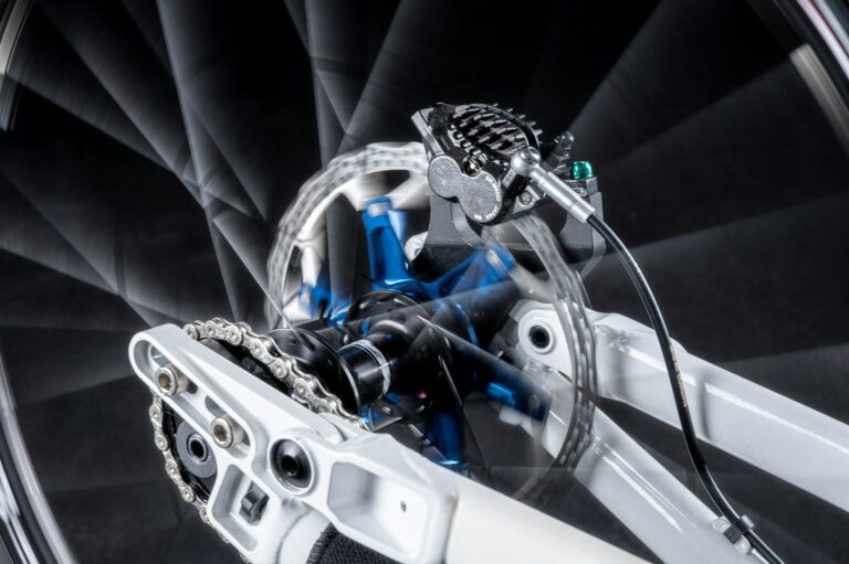 A- lose up of a bikes front wheel